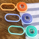 Multifunctional silicone bottle opener