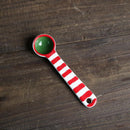 Red and green striped tea spoon