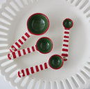 Red and green striped tea spoon